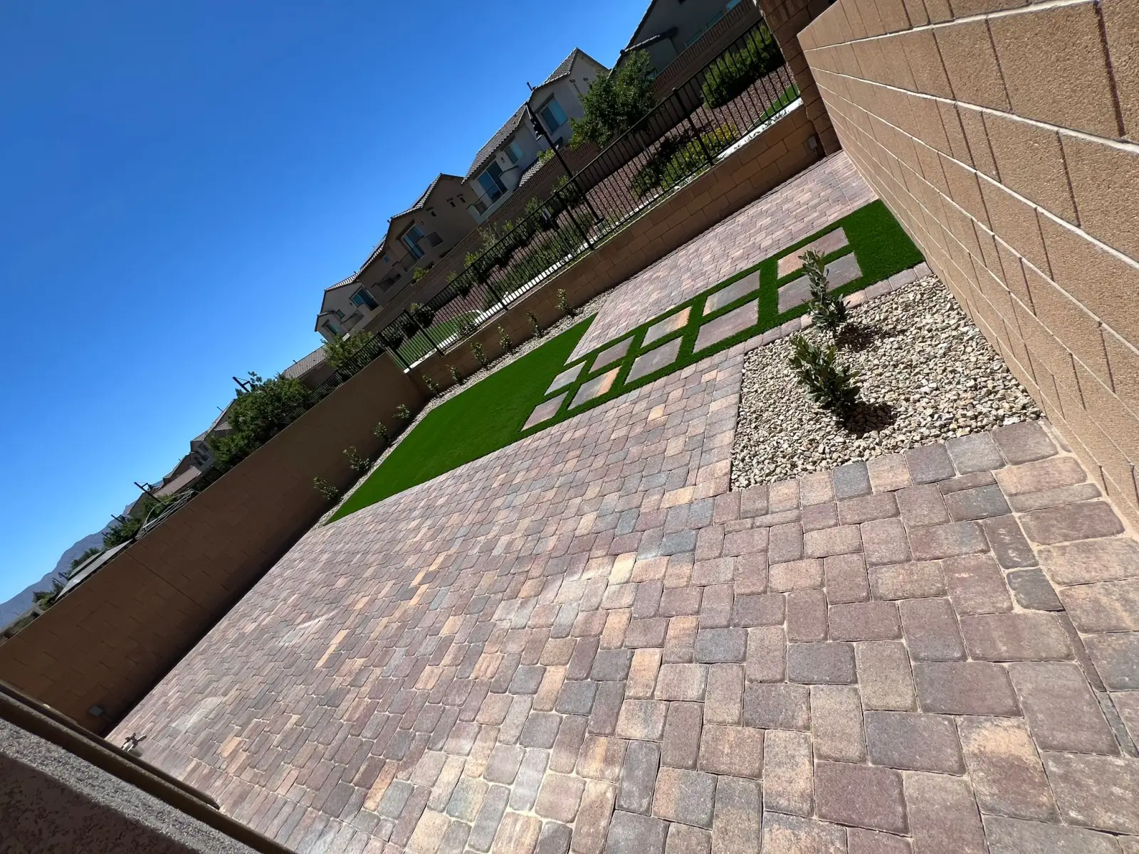 Custom landscape design with plants and ground cover by Ayala Landscaping LLC